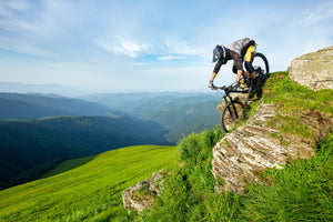 Flow Tyres, man descending rocky section on a mountain bike