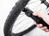Topeak Mountain DA G Mini Pump being used to inflate a bicycle tyre