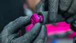 Muc-Off Stealth Tubeless Puncture Plug being inserted into a bar end