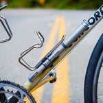 Blackburn Core Slim Mini-Pump mounted to a bike bottle cage