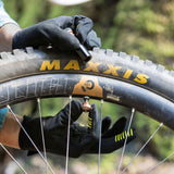 Blackburn Pro Plugger Tubeless Tyre Repair Tool being used to remove presta valve core